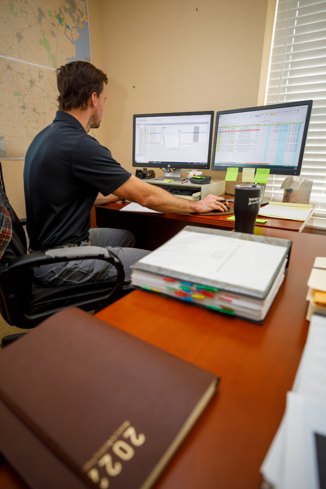 Wes begins his day in the office, at his computer