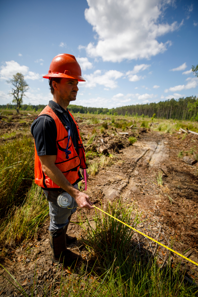 Wes holds diameter tape to measure shear lanes