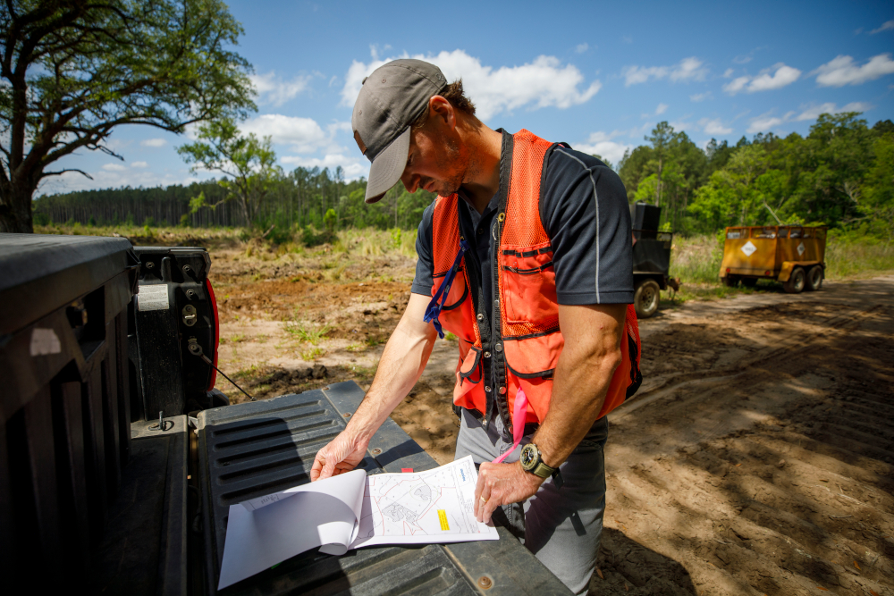 Wes looks over site prep maps